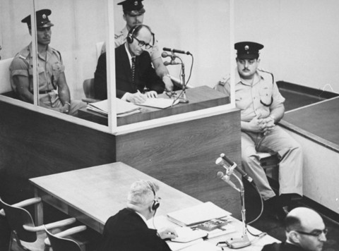Eichmann taking notes at his trial in 1961