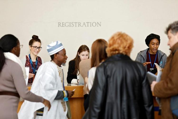 Five delegates registering at the CSW62