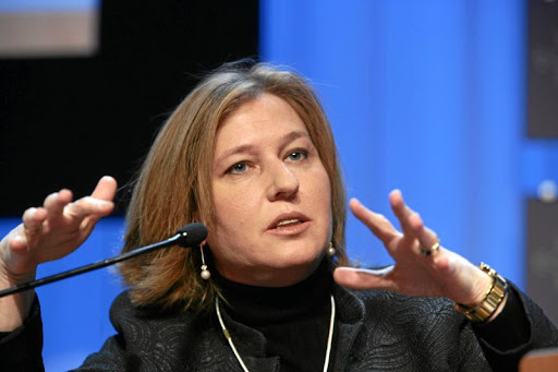 Tzipi Livni talking into a microphone